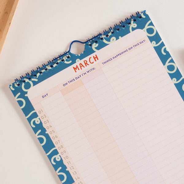 Colorful 'Kids Co-Parenting Family Calendar'. Showing day of the week, parent & actvity sections. 100% Recycled Paper.