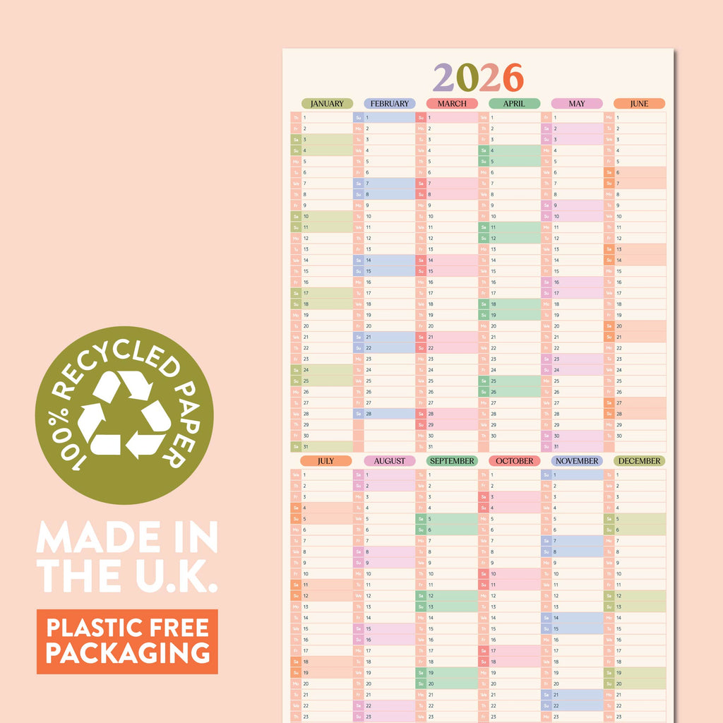 A full-view image of a 2026 pastel compact wall planner in portrait orientation, with a green circle on the left stating "100% RECYCLED PAPER" and text below saying "MADE IN THE U.K." and "PLASTIC FREE PACKAGING."