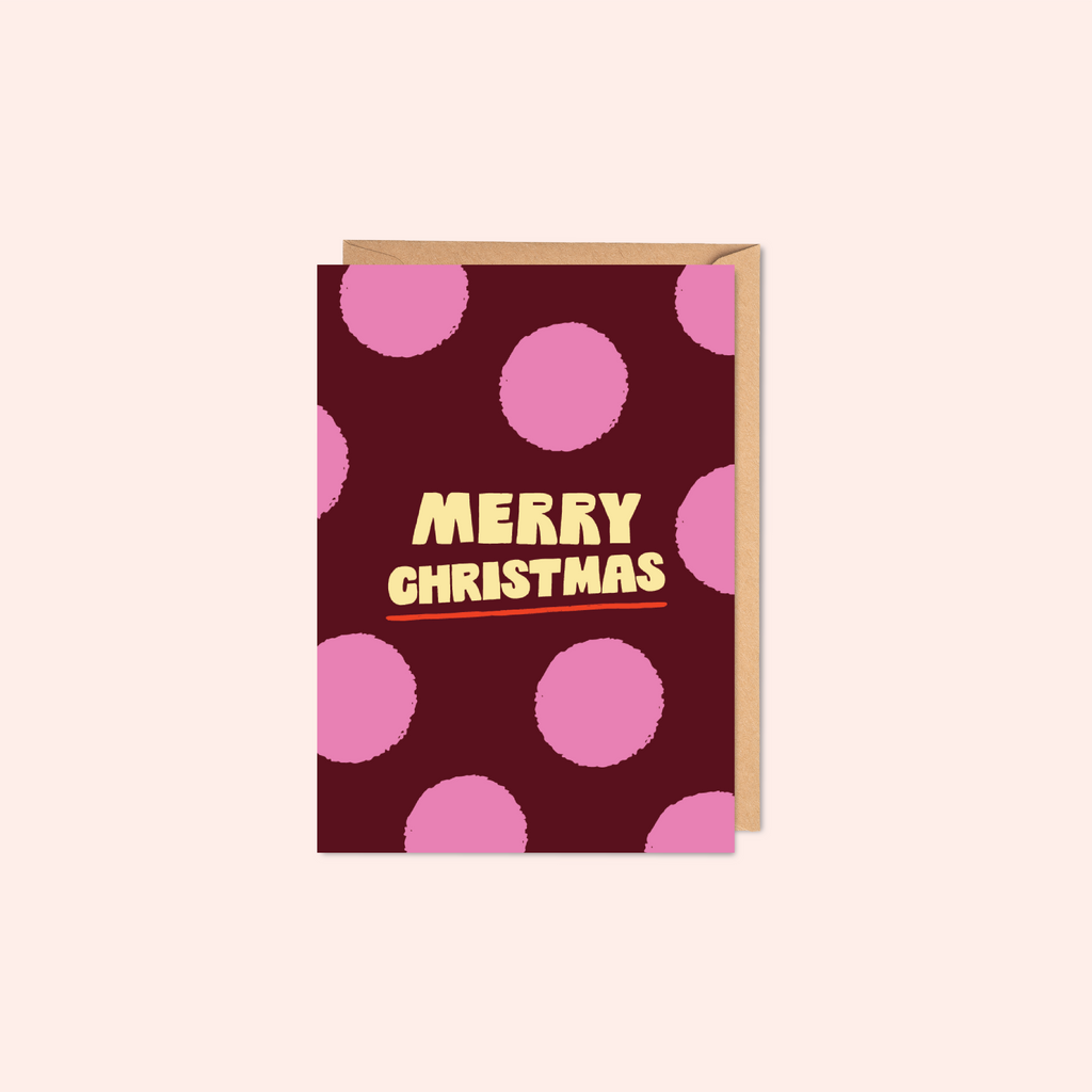 Greeting card with pink polka dots and 'Merry Christmas' text
