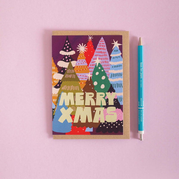 Christmas card with colorful Christmas tree design and 'Merry Xmas' text