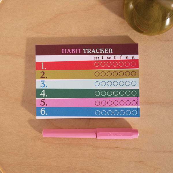 A6 weekly habit tracker pad in bold Work Hard Play Nice design
