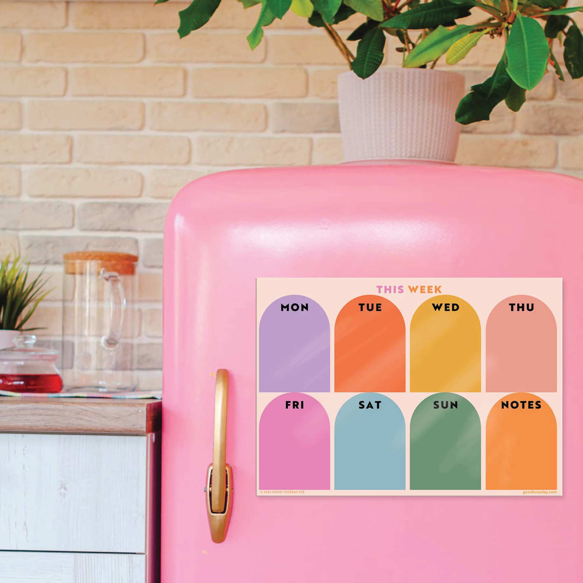 Weekly Fridge Magnet Planner on a Pink Fridge.