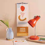 2026 Couples Calendar, oranges, reds and peach colour scheme. 