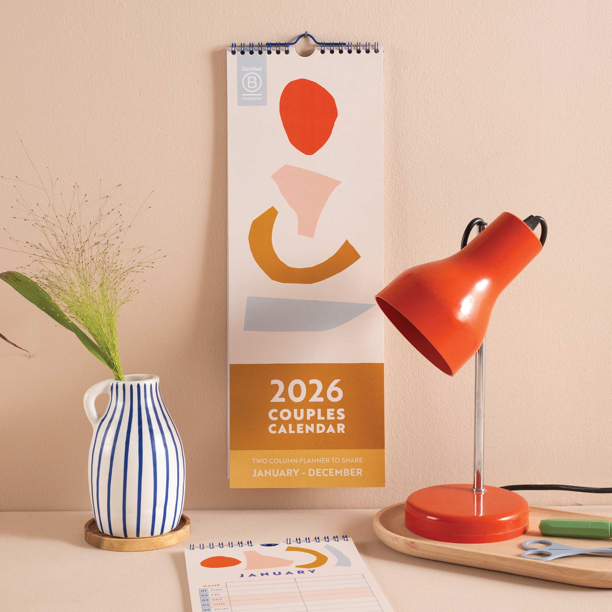 2026 Couples Calendar, oranges, reds and peach colour scheme. 