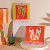 2026 Calendar with a design of a cat on a yellow background.