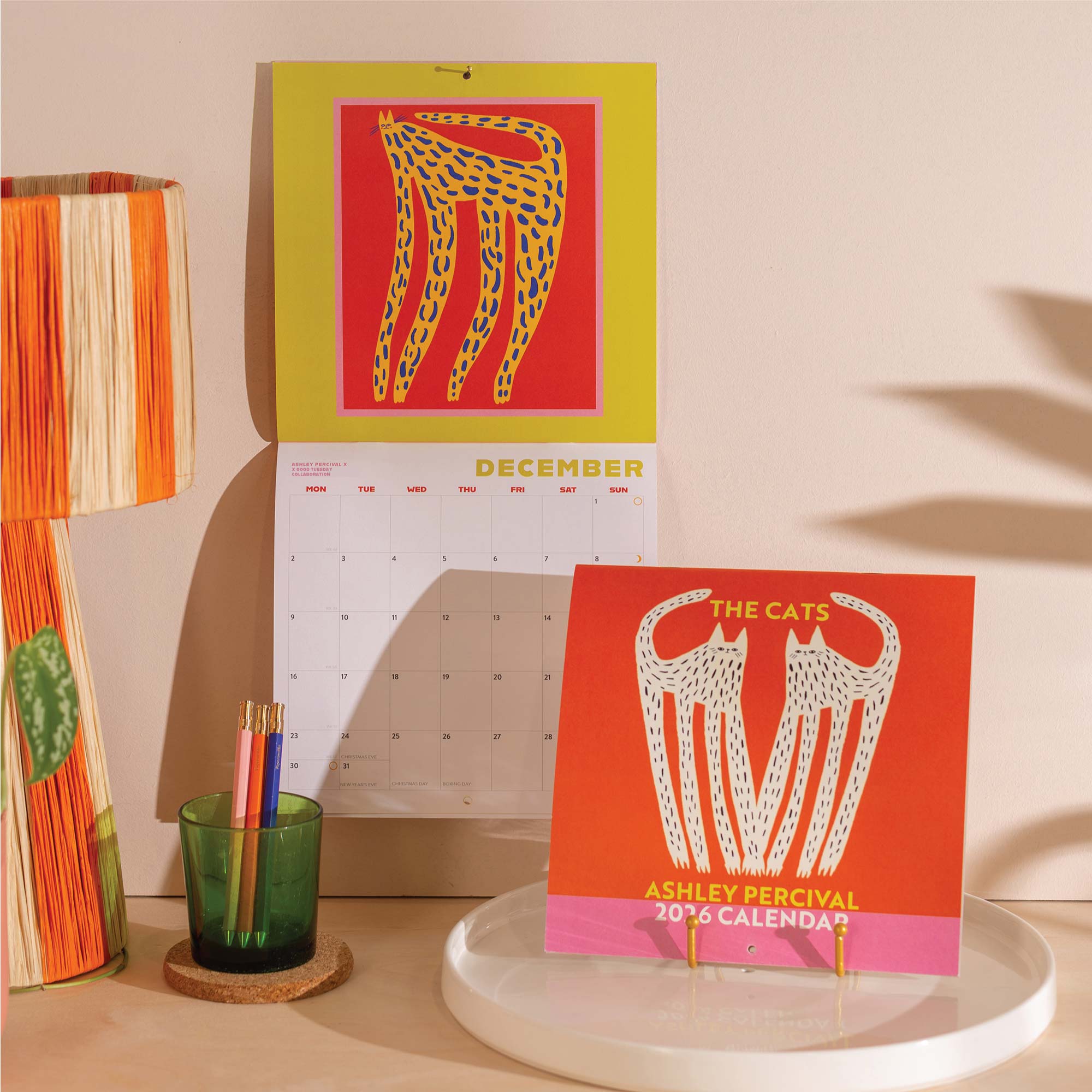 2026 Calendar with a design of a cat on a yellow background.