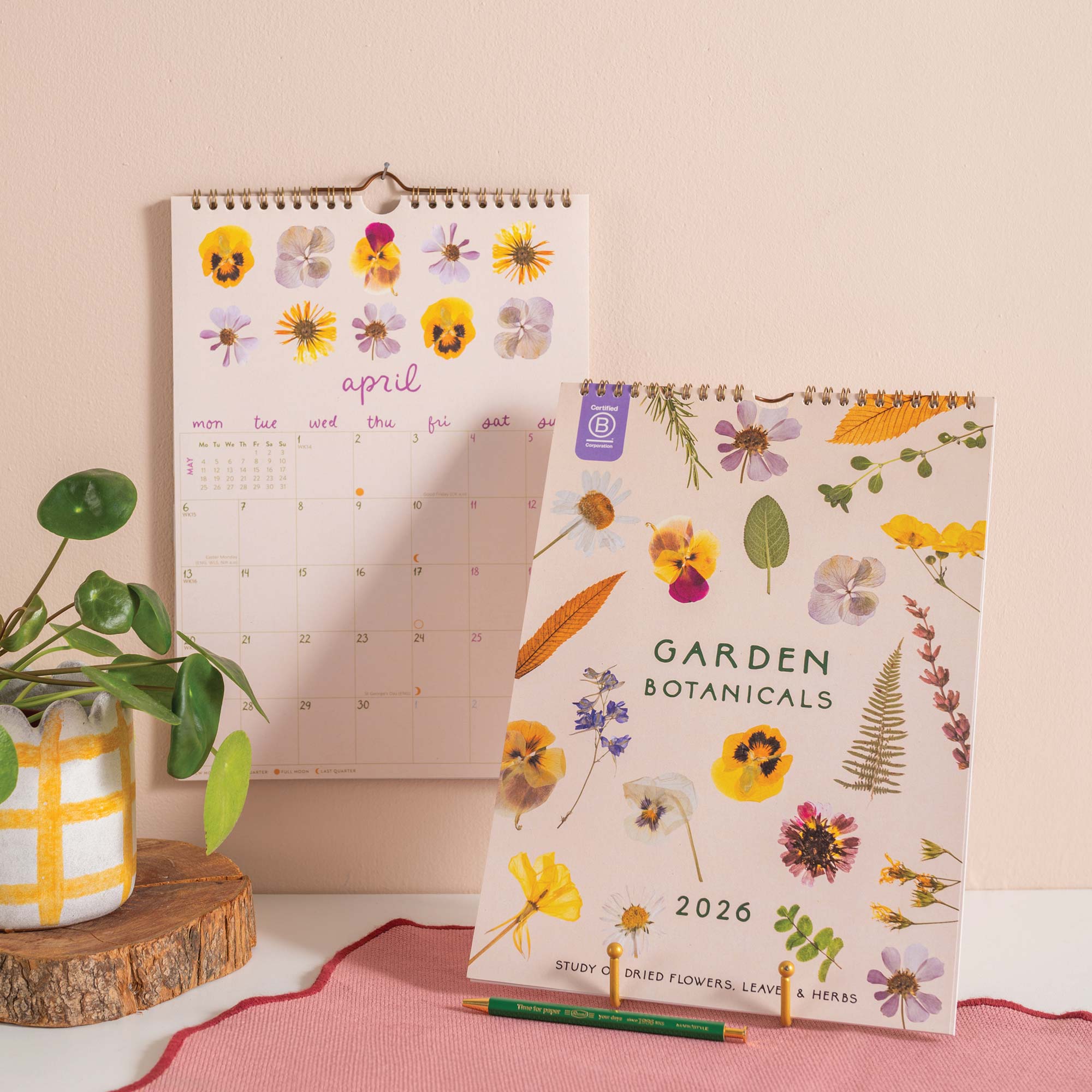 2026 Garden Botanicals calendar with floral design with grid for writing.  