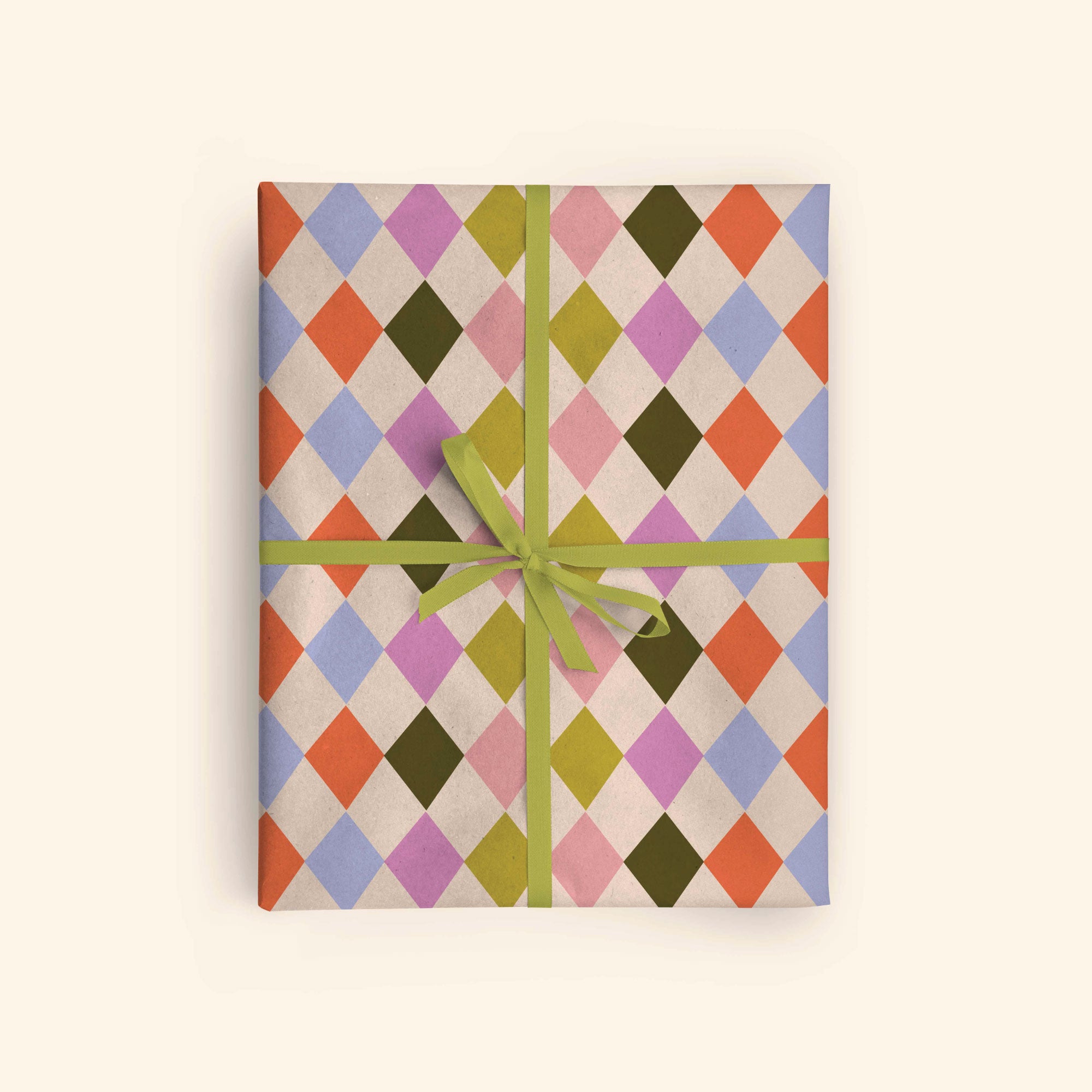 Good Tuesday's eye-catching Harlequin recycled wrapping paper, beautifully displayed as eco-friendly gift wrap, designed and proudly made in the UK.