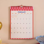 2026 Wall calendar for February with a red and white checkered border.
