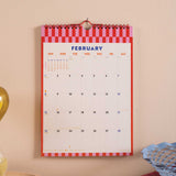 2026 Wall calendar for February with a red and white checkered border.