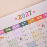 Good Tuesday's Calendar for the year 2027 with colorful month labels. 100% Recycled paper. Bcorp Certified. 