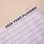 Close up of Good Tuesday's 2026 black and white landscape wall planner. 100% Recycled paper. 
