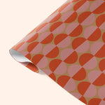 Close-up detail of Good Tuesday's Peach Sunsets wrapping paper, showcasing the vibrant, abstract design and high-quality finish on our eco-conscious gift wrap.