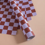 Good Tuesday's eye-catching Tidal Berry recycled wrapping paper, beautifully displayed as eco-friendly gift wrap, designed and proudly made in the UK.