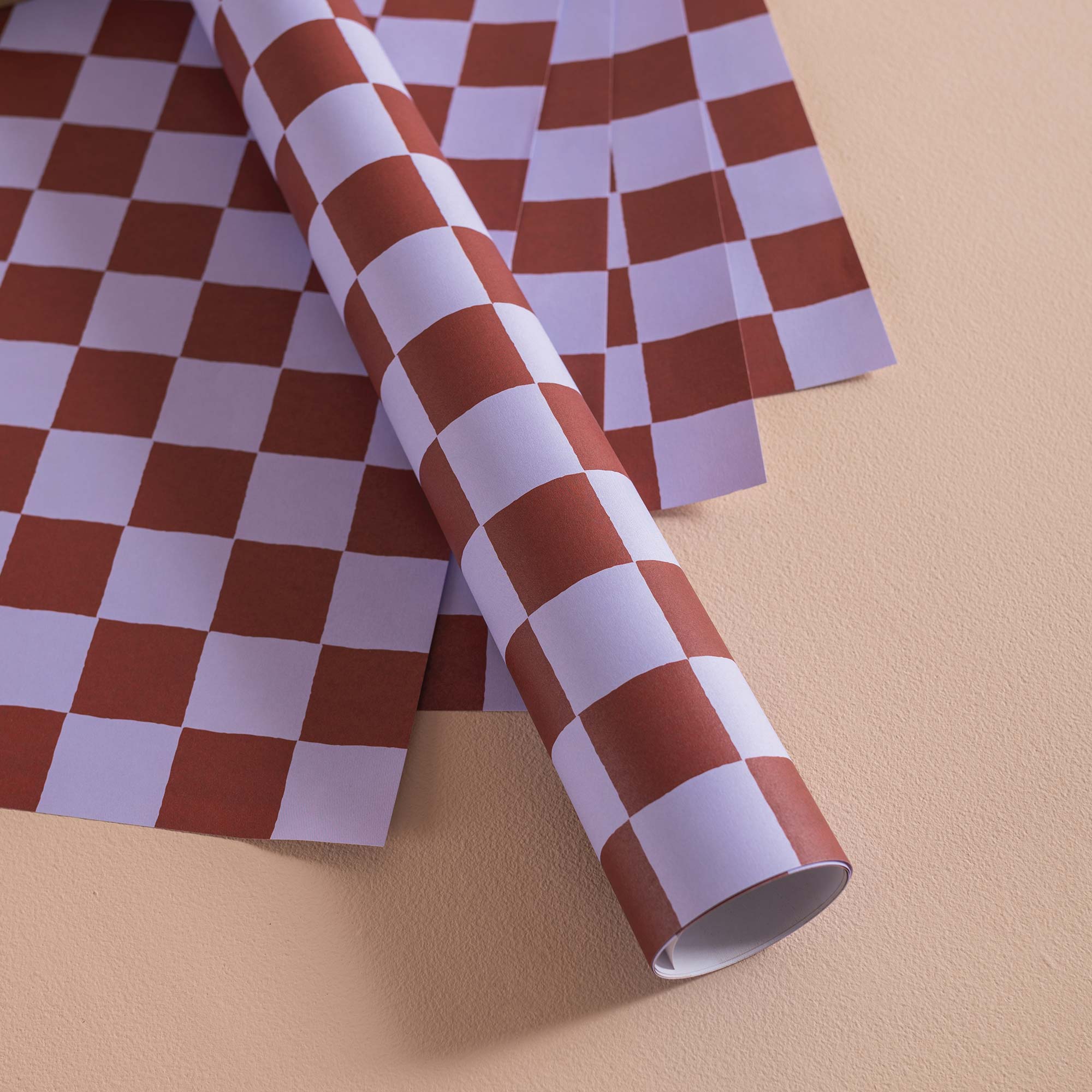 Good Tuesday's eye-catching Tidal Berry recycled wrapping paper, beautifully displayed as eco-friendly gift wrap, designed and proudly made in the UK.