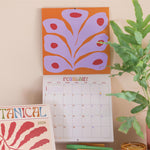 2026 Wall calendar with bright floral design.