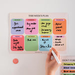 Good Tuesday's brightly coloured A4 weekly planner. Magnetic Fridge planner. Boxes for each week day and notes. Wipeable and reusable.