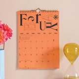 Good Tuesday's Orange calendar with 'February' 2026. Colorful. 100% recycled paper. Bcorp Certified.