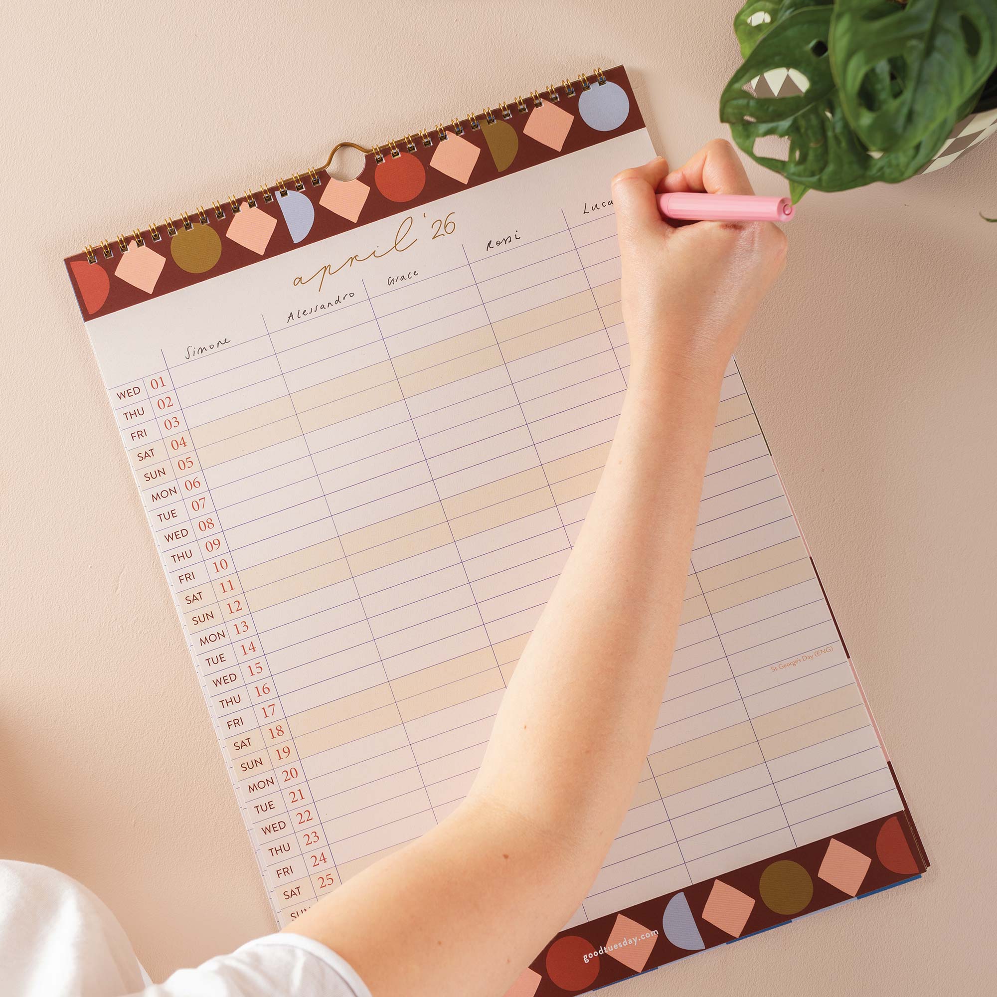 Close-up of April 2026 family planner with header row filled in with names in each of the 5 columns