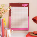 Close-up of April 2026 family planner with 5 columns, highlighted weekends, and UK and US holidays included