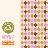 Textured view of Good Tuesday's Harlequin wrapping paper, highlighting the unique feel and visible recycled fiber quality of our 100% recycled gift wrap.