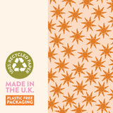 Textured view of Good Tuesday's Sunbeam wrapping paper, highlighting the unique feel and visible recycled fiber quality of our eco-conscious gift wrap.