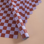 Good Tuesday's eye-catching Tidal Berry recycled wrapping paper, beautifully displayed as eco-friendly gift wrap, designed and proudly made in the UK.