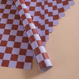 Good Tuesday's eye-catching Tidal Berry recycled wrapping paper, beautifully displayed as eco-friendly gift wrap, designed and proudly made in the UK.