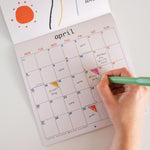 2026 Abstract Surrealist calendar.  Image showing the month of April. Calendar has well sized boxes to write in for each day. 