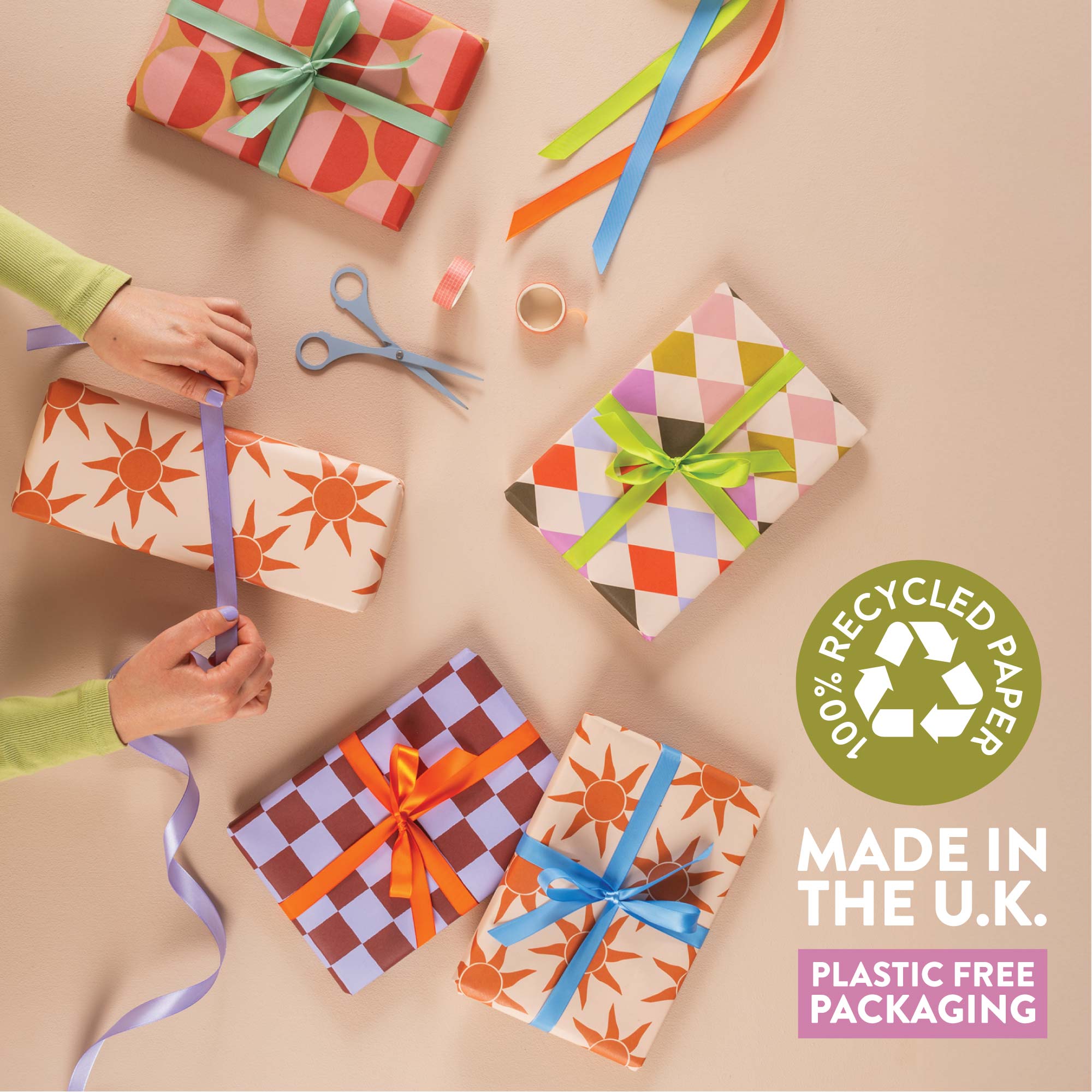 Good Tuesday's vibrant Sunbeam recycled wrapping paper, beautifully displayed as eco-friendly gift wrap, designed and proudly made in the UK.