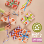Good Tuesday's eye-catching Tidal Berry recycled wrapping paper, beautifully displayed as eco-friendly gift wrap, designed and proudly made in the UK.