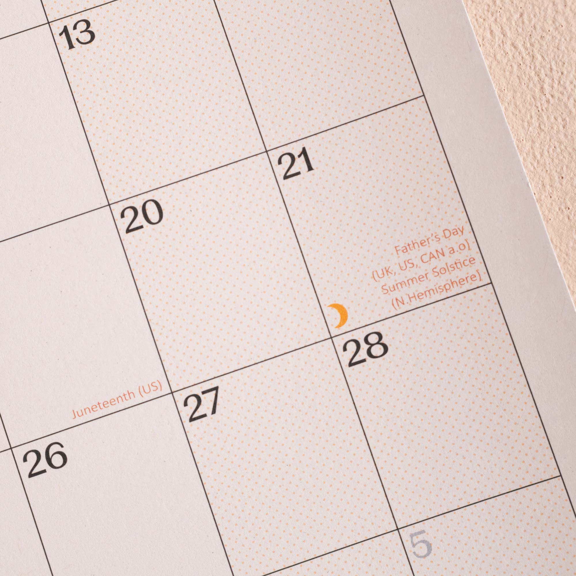 Calendar with dates and holidays marked.