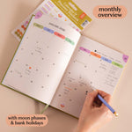 Open planner with January 2026 monthly overview, includes moon phases and bank holidays.