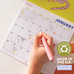 2026 bright and colourful Calendar with a Cat artwork by the artist Ashley Percival. Each month has a gird layout showing the days of the month and a colourful illustration from the artist.