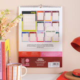 Back cover showing calendar layout previews and extras info