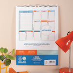 Back cover showing calendar layout previews and extras info