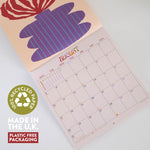 Calendar with a plant design, featuring recycled paper and plastic-free packaging text.