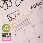 Calendar page with August and September dates, recycled paper logo, and plastic-free packaging text.