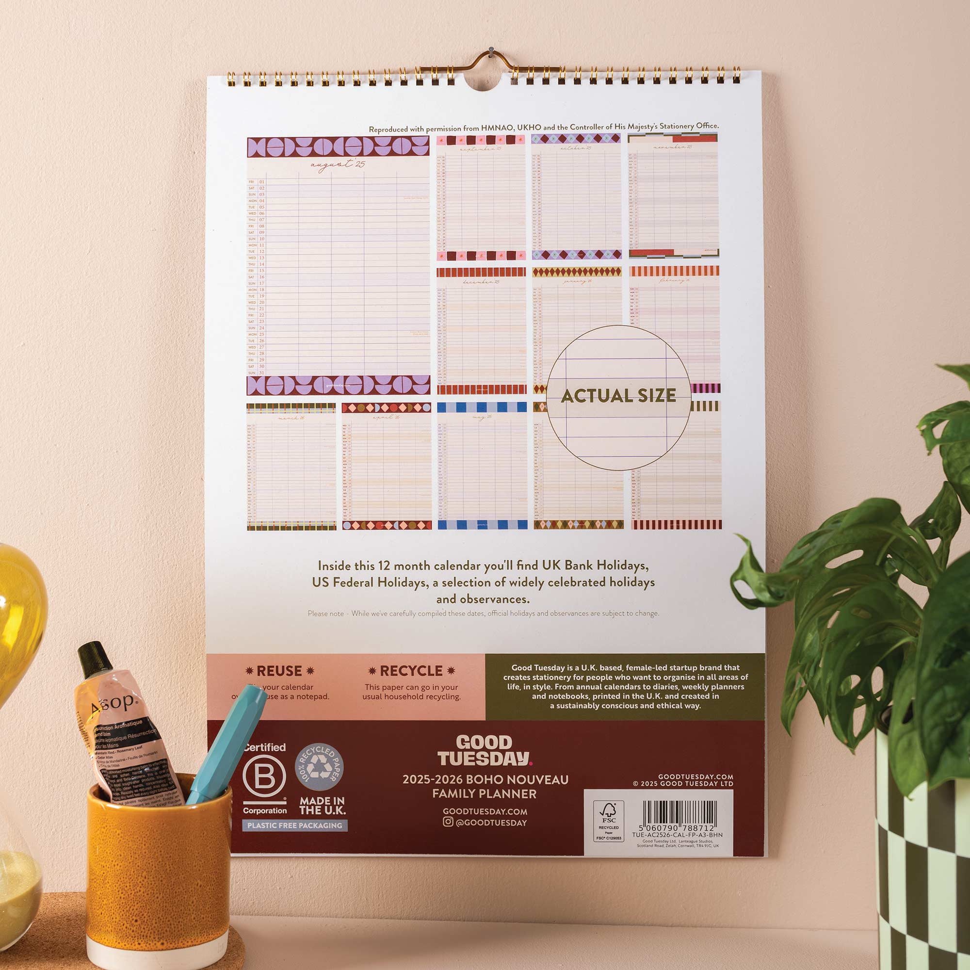 Back cover showing calendar layout previews and extras included info