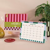 2026–2027 flip desk calendar in bold retro check design standing on desk