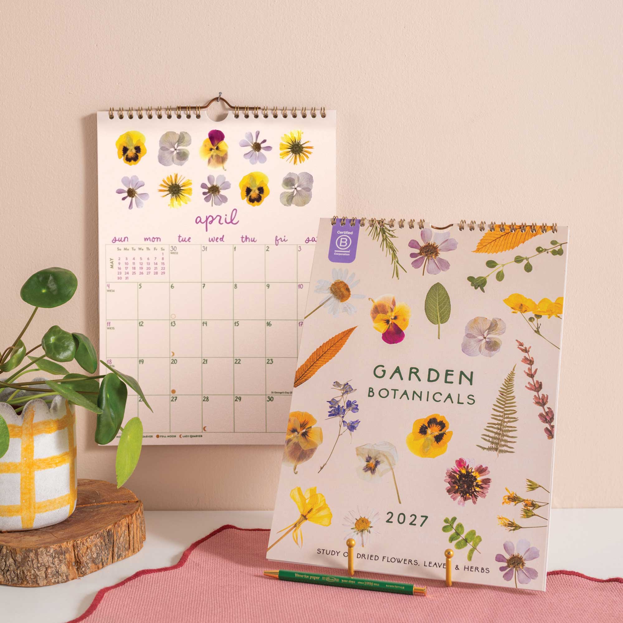 2027 A4 wall calendar with Garden Botanicals design hanging on wall