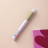 A multiclick turquoise pen with a purple rubber grip