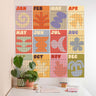 Colorful calendar wall art with geometric designs on a white wall.