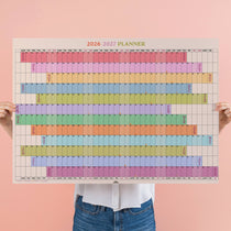2026–2027 academic year wall planner by Good Tuesday in a rainbow colour block layout showing September to August.