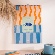 2026–2027 A3 family wall calendar in Coastal Stripe design hanging on wall