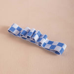 Blue and white checkered bookband, holds 4 pens