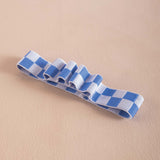 Blue and white checkered bookband, holds 4 pens
