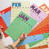 Butter &  Bold style undated A3 wall planner displayed on wall with muted colour palette