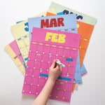 Retro Daze style undated A3 wall planner displayed on wall with muted colour palette
