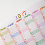 2027 Wall Planner with colourful month labels on a white background